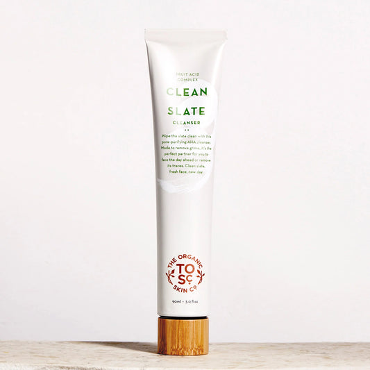 Tube of Clean Slate facial cleanser by The Organic Skin Co. with a wooden cap on a white background