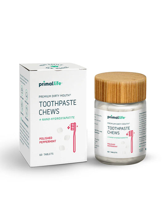 Primalife toothpaste chews packaging with a glass jar and bamboo lid on a white background